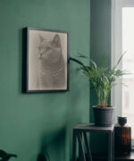 A room with a pencil sketch of a cat in a black frame on a green wall